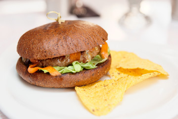 Hamburger with chips in a fast food restaurant