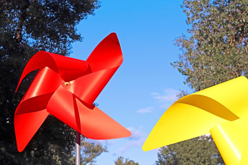 Large red and yellow children pinwheels in the Natalka park, Kyiv, Ukraine