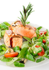 Rare fried salmon steaks in plate