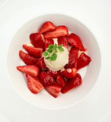 Flambe strawberries with ice cream