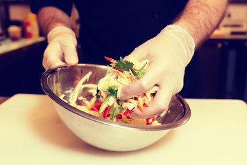 Chef is cooking a vegetarian salad, toned image