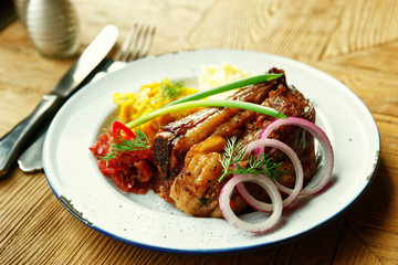 Grilled pork ribs with sauerkraut and mashed potatoes, toned ima