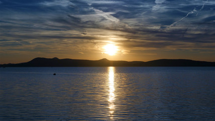One of Europe's largest lakes - Balaton. Popular tourist tours from many continental countries. Shallow fast warming lake.
