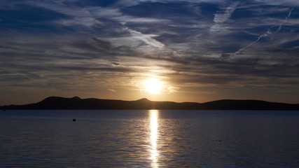 One of Europe's largest lakes - Balaton. Popular tourist tours from many continental countries. Shallow fast warming lake.