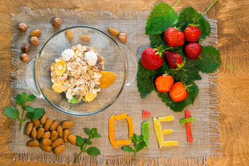 Milk and muesli with nuts and strawberries for Breakfast. Healthy eating.