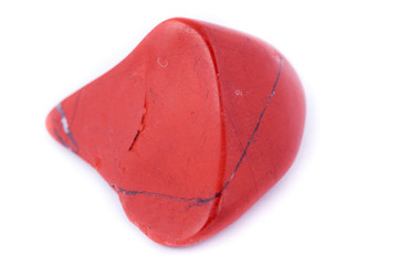 macro red jasper stone, close-up on a white background