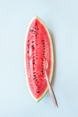 Fresh ripe watermelon on the blue background, top view. Summer time concept