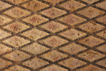 Background metallic old rusty surface with rhombuses.