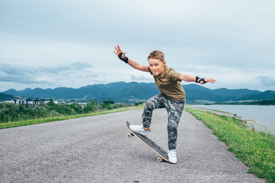 Boy makes a trick on skateboard