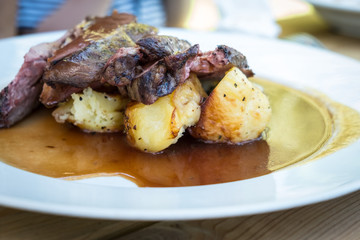 Lamb shank without bones with baked potatos