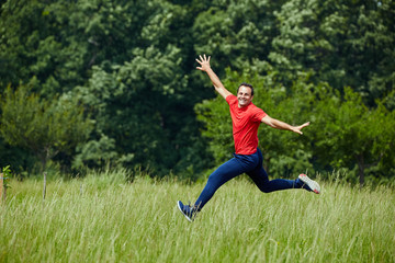 Happy man jumping for joy