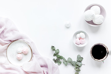 woman lunch with marsh-mallow, coffee and flowers soft light on white table background flat lay mock-up