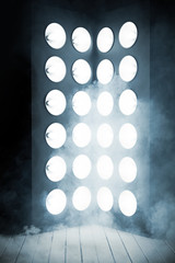 Mystic interior, wooden stage and a light column