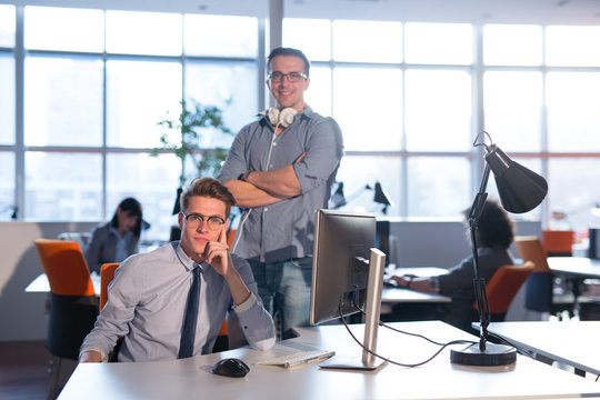 Two Business People Working With computer in office