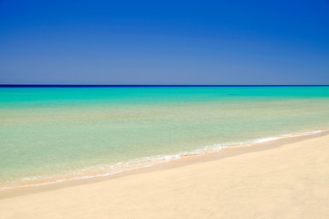 Fototapeta na wymiar Crystal sea water with amazing colours on Fuerteventura, Spain.
