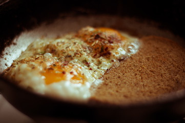 Fried scrambled eggs with seasonings and bread