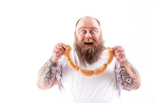 Man Holding Sausage Links