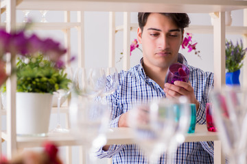 Young handsome man shopping in shop