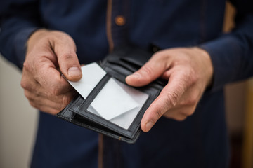 Bank card, business card, wallet, businessman holds in his hands and put the card in your wallet