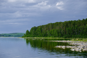 Beautiful landscape on the shore of the mountain lake of the Ural Mountains