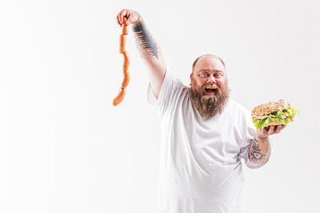 Man holding meat and sandwich