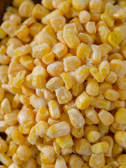 frozen sweet corn on woode surface