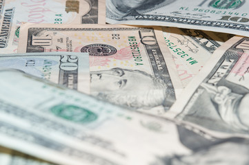 Background of scattered ten and twenty dollar bills close-up