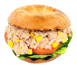 Tuna fish and sweetcorn filled bagel isolated on a white background