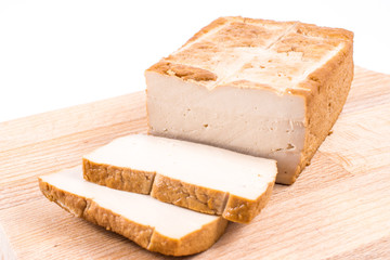 Slices tofu  on a cutting board