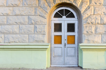 Old weathered rustic doors of vintage building.