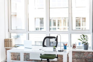 Comfort workspace with flower pot and family picture