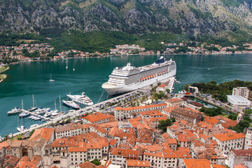 Kotor bay with a big ship in the harbour view from the top. Travel background.