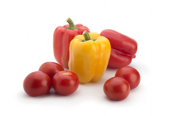 Red peppers and tomatoes on a white background
