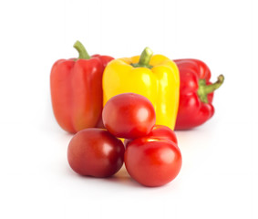 Red peppers and tomatoes on a white background