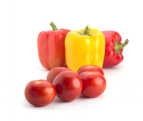Red tomatoes and pepper on a white background