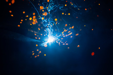 abstract welding sparks light, industrial background