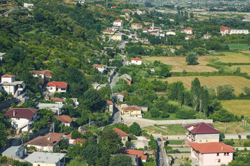 Fototapeta na wymiar Village in Albania top view buildings and road.