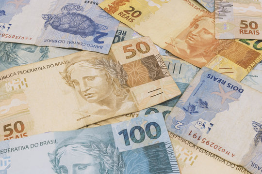 Brazilian money background. Bills called Real, different values. Economy of Brazil concept image.