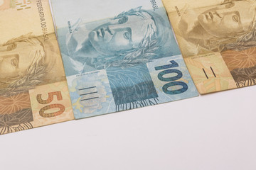 Brazilian money background. Bills called Real, different values. Economy of Brazil concept image.