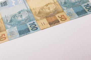 Brazilian money background. Bills called Real, different values. Economy of Brazil concept image.
