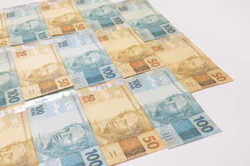 Brazilian money background. Bills called Real, different values. Economy of Brazil concept image.