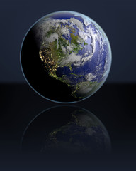 Globe facing North America in dark