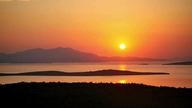 Timelapse of sunset over Aegean Sea. Sundown time at Seytan Sofrasi Ayvalik, Turkey Country. 4K 20 sec 30fps High quality Time Lapse