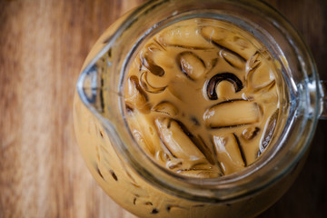 Top view of iced coffee on wooden table