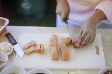 seafood chef slicing salmon fish