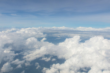 Fototapeta na wymiar Blue sky and Clouds as seen through window of aircraft