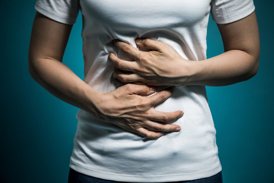 young woman having a stomachache.