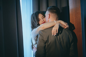 Bride and groom kisses tenderly in the shadow of a flying veil .beautiful pictures. guys enjoy.