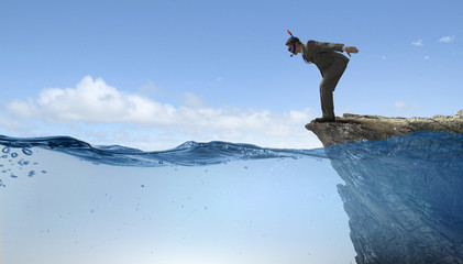 Businessman diving from top . Mixed media