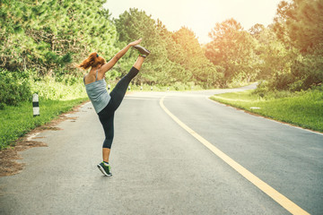 Women exercise on the street. Nature park. Asian women